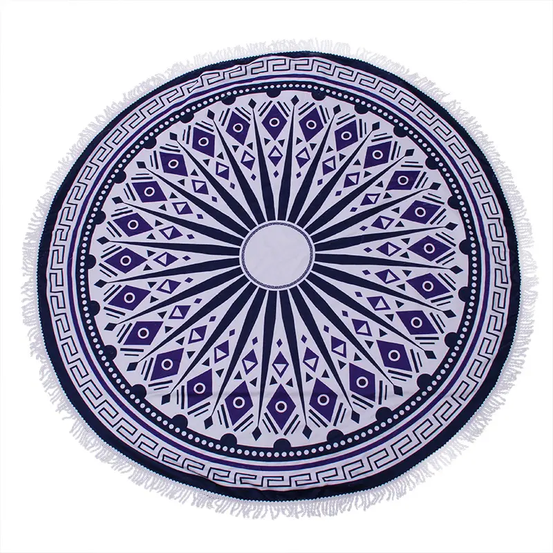 Navy and white round beach towel with a radial geometric pattern, Greek key border and white fringe.