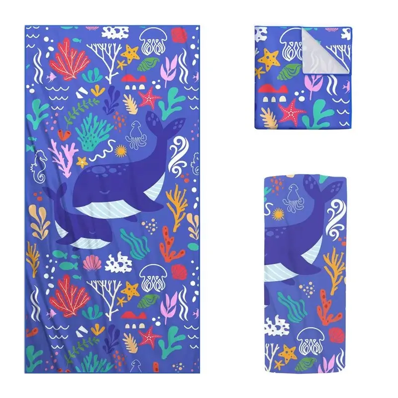 Blue beach towel with whales and colorful sea life shown flat, folded and rolled.