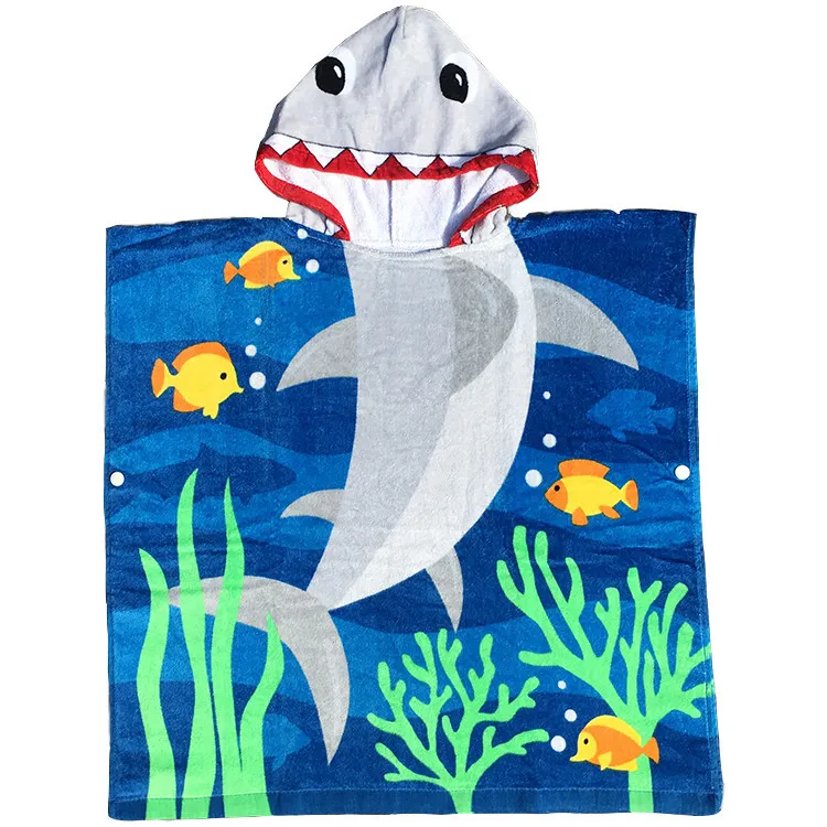 Children's blue hooded beach towel with a shark-shaped hood, a gray shark, yellow fish and green sea plants.